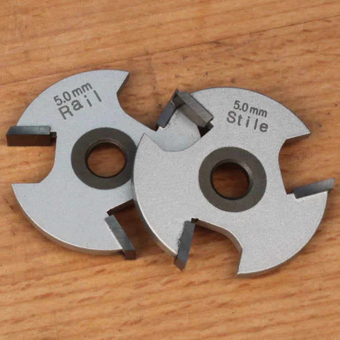 5mm rail and stile woodworking cutter blades on wood surface