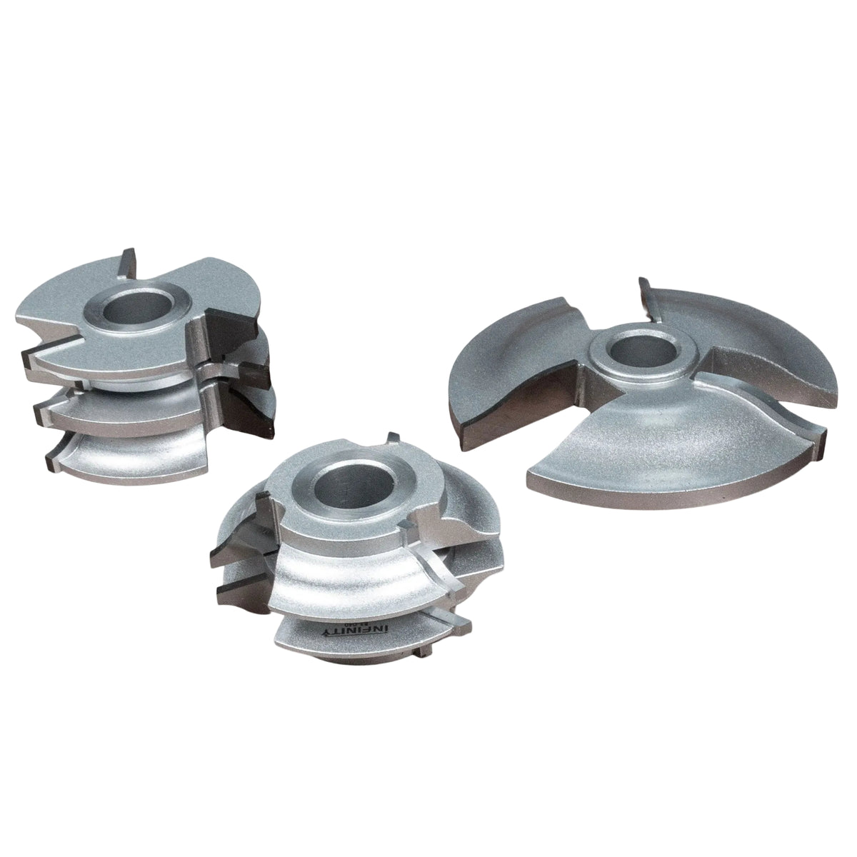 Ogee shaper cutter set for woodworking, three carbide-tipped cutting heads on white background