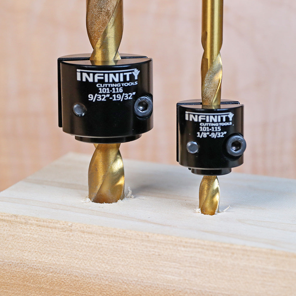 Two drill bit stop collars on gold drill bits boring holes in wood for woodworking precision.