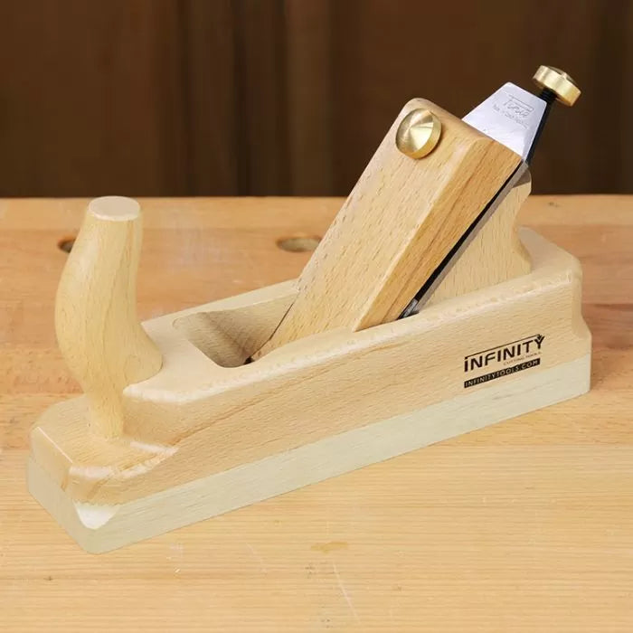 Wooden hand plane tool on a workbench for precision woodworking projects