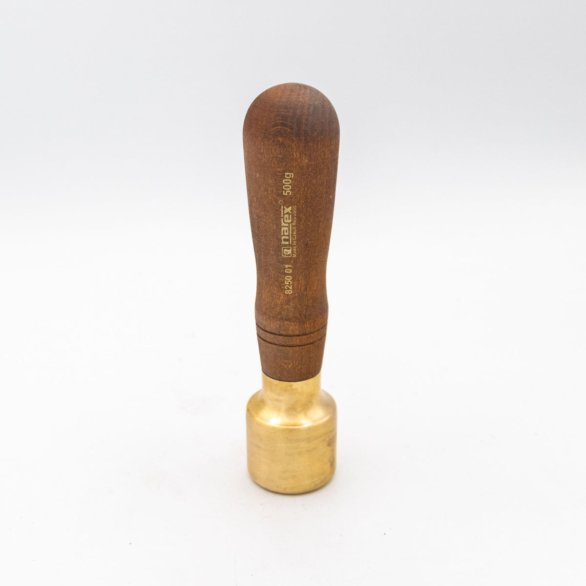 Brass woodworking mallet with a wooden handle on a white background