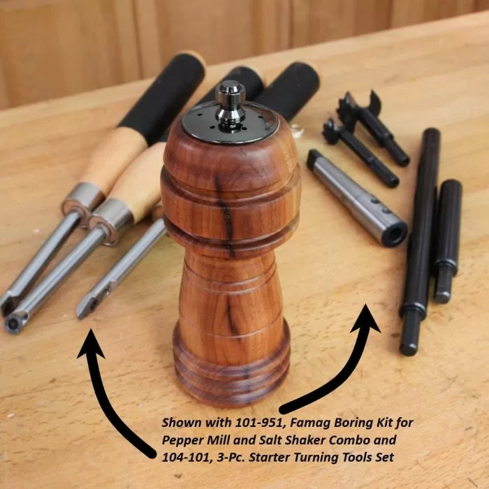 Wood pepper mill with starter woodturning tools and boring kit on a workbench