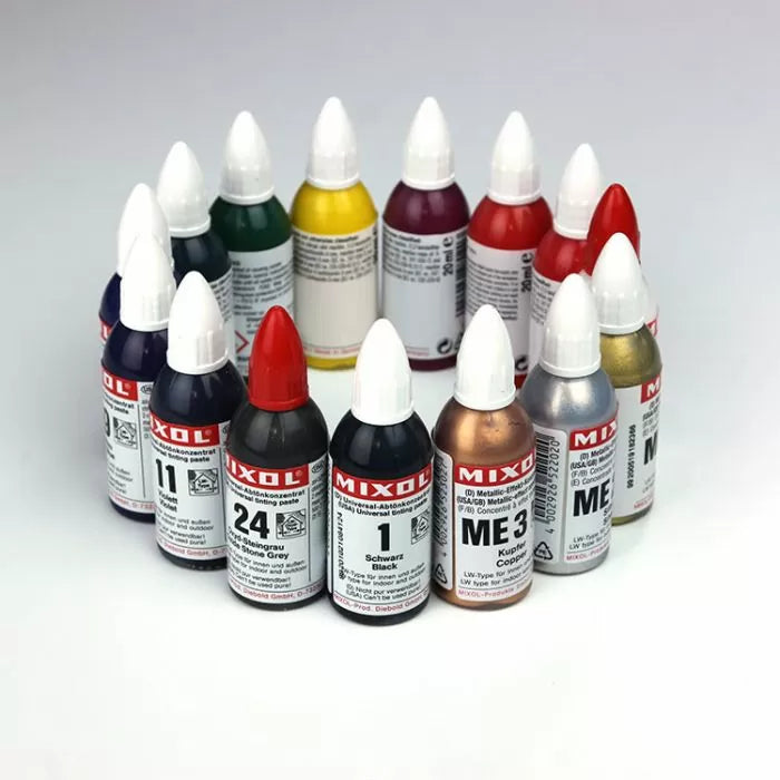 Assorted MIXOL universal colorant bottles in various colors for woodworking finishing projects