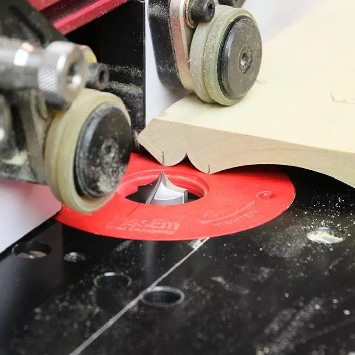 Woodworking router table edge forming bit cutting decorative groove on wooden board