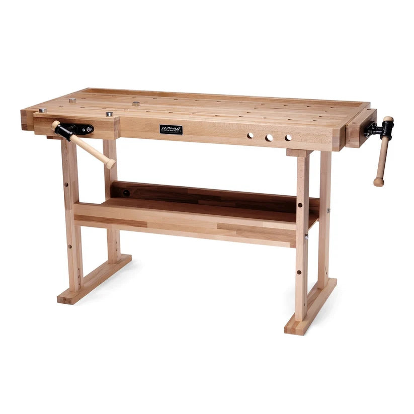 A light natural wood workbench with a slotted top, lower shelf, and black metal clamping hardware with wooden handles, shown on a plain white background.