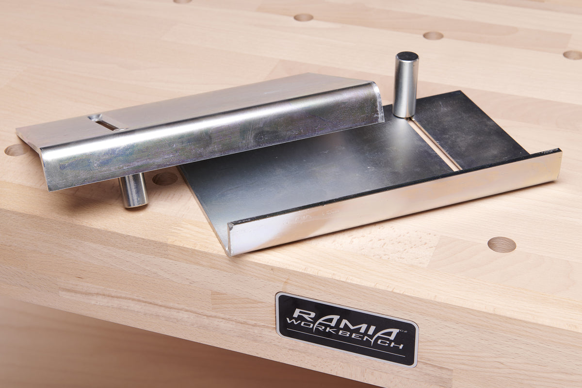 Metal workbench attachment on a wooden surface with 'RAMIA Workbench' branding.