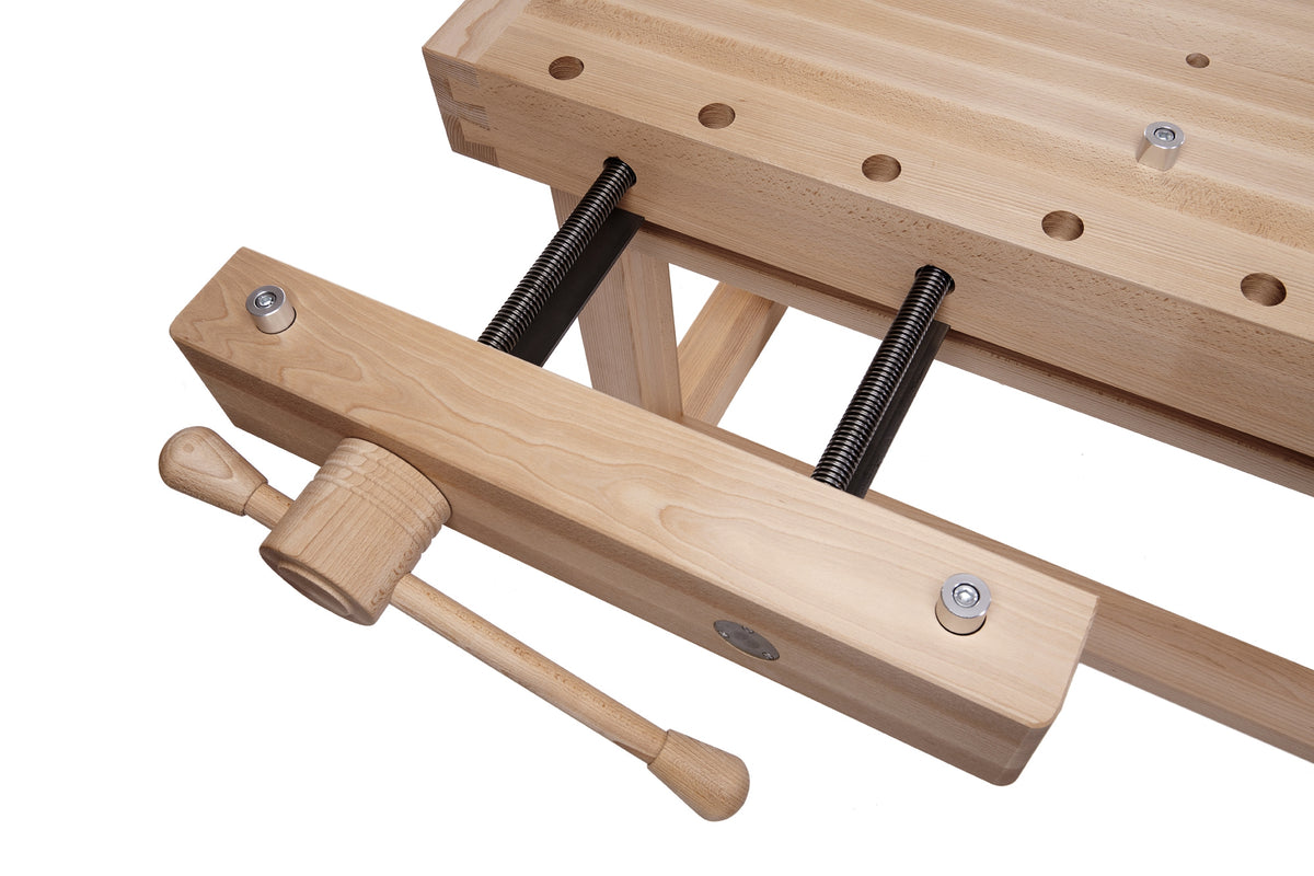 Close-up of a wooden workbench clamp with a hand wheel and threaded screw bars on a white background.