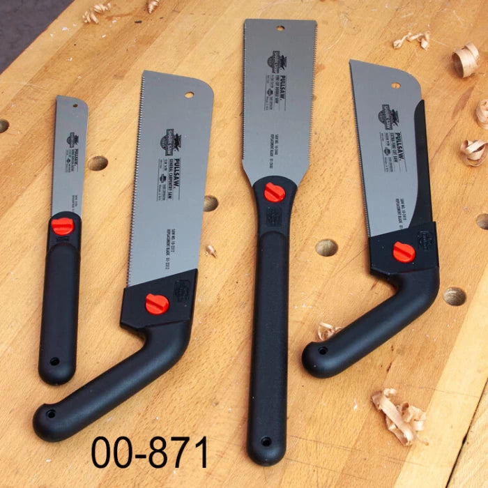 Set of four Japanese pull saws with black handles on a woodworking bench