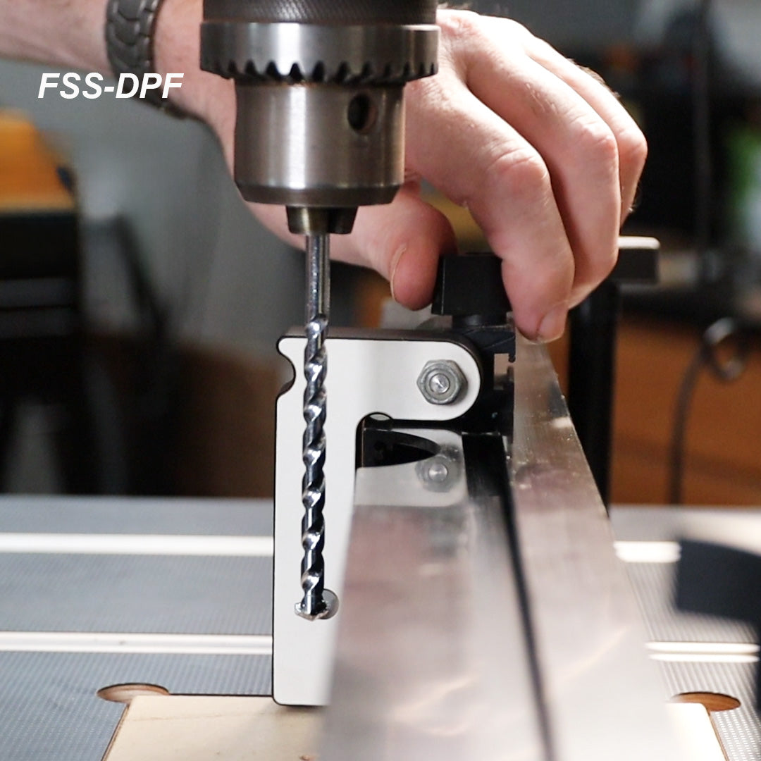 Drill press fence stop block in use with drill bit for accurate woodworking setups