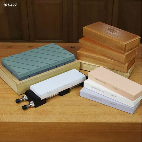 Sharpening stones, diamond plate and stone holder on wooden bases