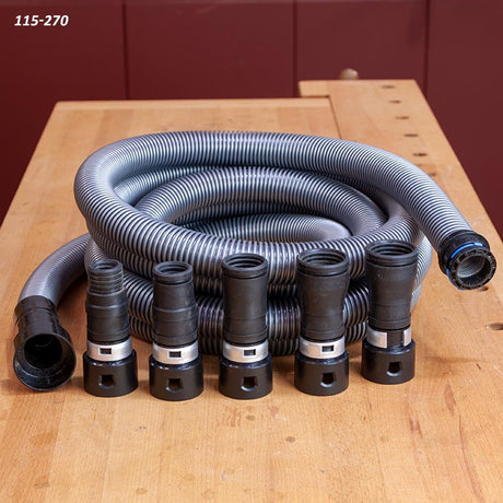 Coiled anti-static vacuum hose with a set of power tool adapters