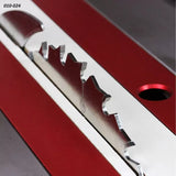 Close-up of table saw blade in red and silver insert plate for woodworking