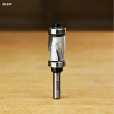 Carbide spiral flush trim router bit with dual bearings on a wood surface