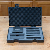 Infinity Tools precision setup blocks fitted in their foam-lined storage case on a workbench