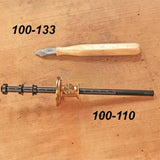 Marking knife and woodworking marking gauge on wooden surface with product numbers shown.
