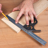 Using a combination square to mark precise lines on a wooden board for woodworking