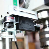 Wixey drill press laser guide mounted on a drill press for precision woodworking