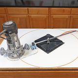 Wood router and circle cutting jig on workbench for precise woodworking cuts
