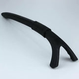 Black plastic pry bar tool with ergonomic handle on a plain background, woodworking accessory
