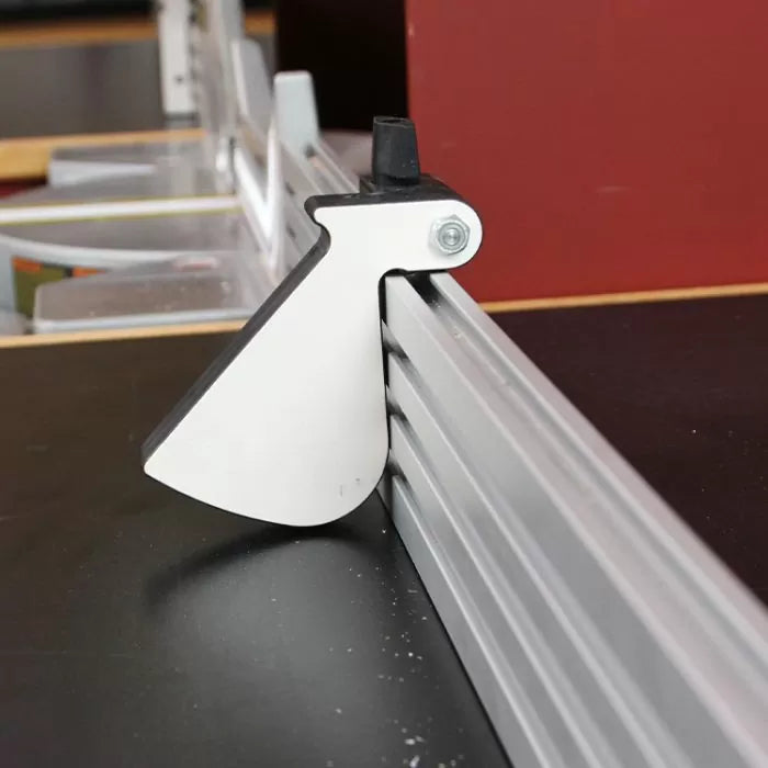 Aluminum router table fence with dust guard attachment in a woodworking setup