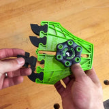 Hands replacing black feather inserts on green woodworking featherboard tool