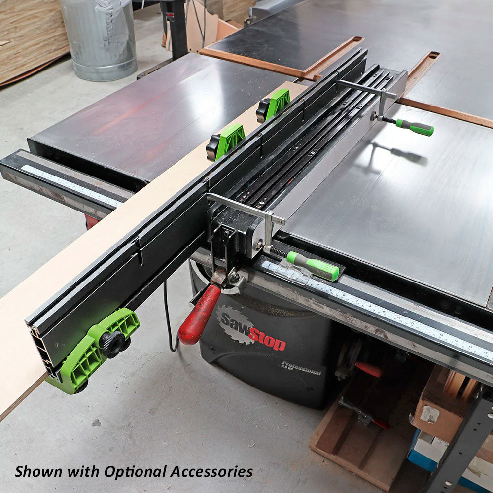 Table saw fence system with measuring rail and green clamps in woodworking shop