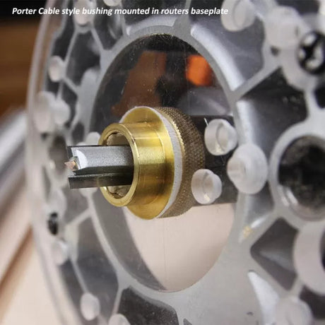 Porter Cable style brass router bushing mounted in router baseplate with bit installed