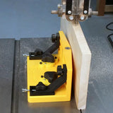 Yellow band saw fence jig holding wood board for precise straight cutting
