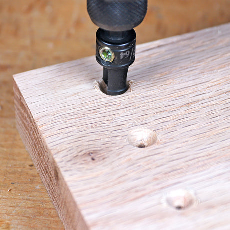 Drill bit making pocket hole in wood board for woodworking joinery