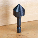 Black carbide countersink drill bit for woodworking on a wooden surface
