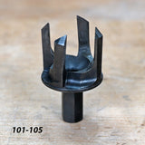 Six-blade woodworking tenon cutter on workbench, used for joinery and precision cutting