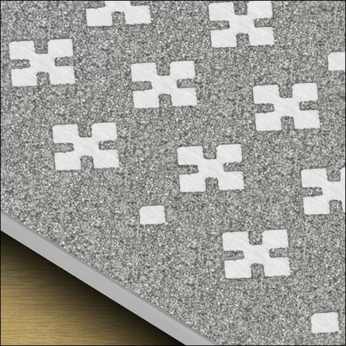 Close-up of gray sandpaper with white cross-shaped anti-slip grit pattern