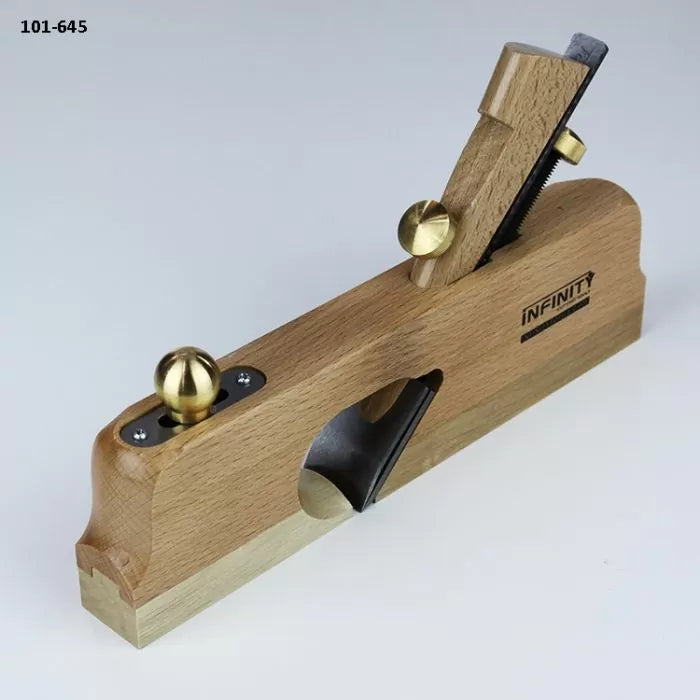 Wooden woodworking hand plane with brass fittings and exposed blade on a white background.