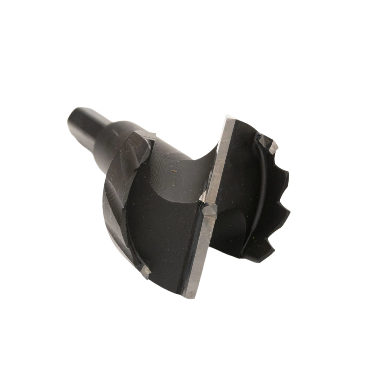 Carbide-tipped Forstner bit for woodworking, sharp edge, clean cutting surface visible