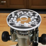 Clear acrylic router base plate for woodworking attached to a plunge router on a workbench
