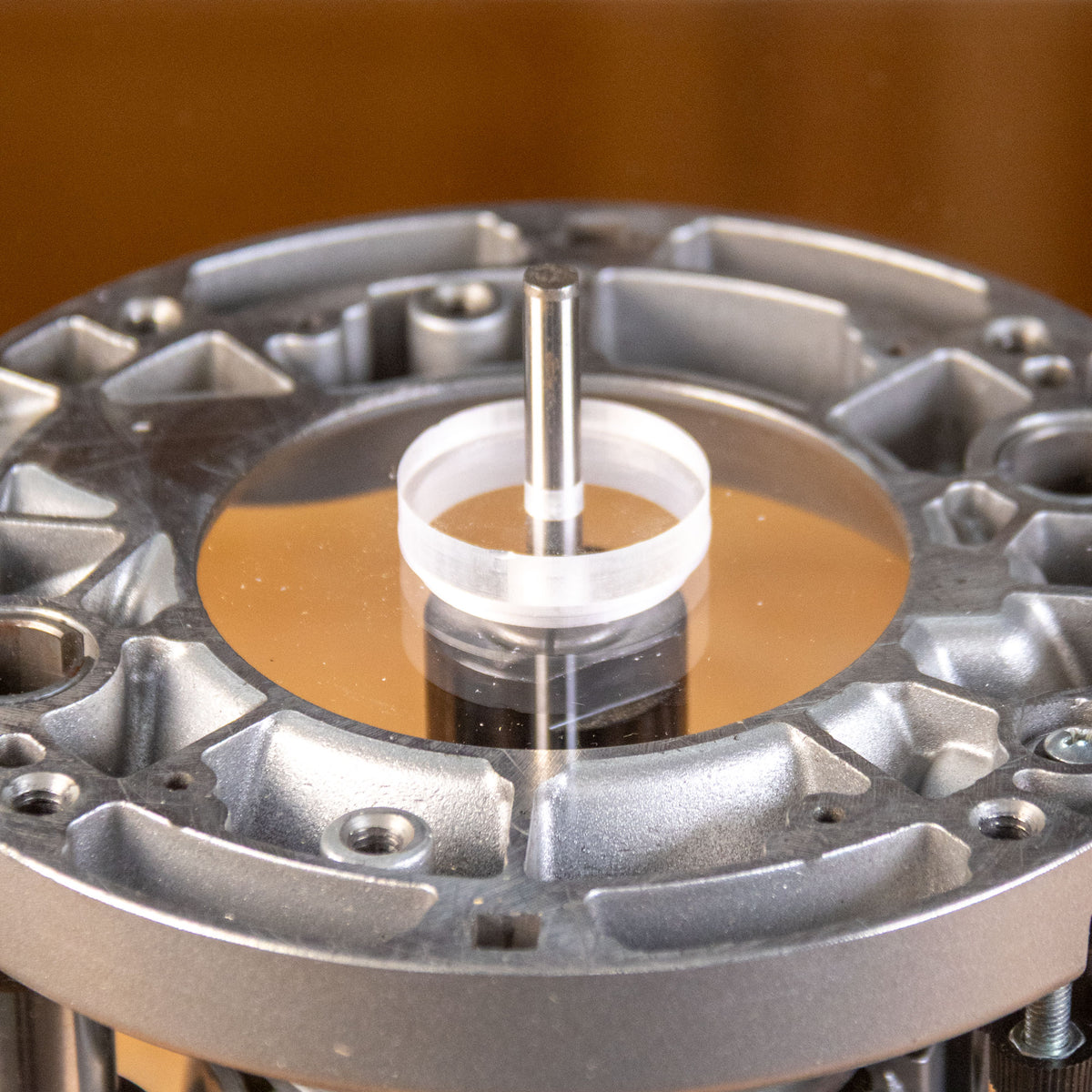 Close-up of the Infinity Tools base plate alignment rod and centering insert