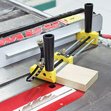 Table saw with yellow woodworking jig and fence guide, securing wood for precise cutting