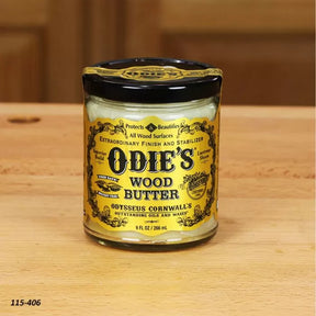 Odie's Wood Butter jar for woodworking finish on a wooden surface