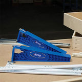 Drawer slide jigs for woodworking, blue plastic guides with metal rails on workbench
