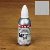 Mixol ME2 silver metallic effect concentrate bottle on wood surface with color swatch