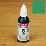 Mixol universal tinting paste green 8 on wood surface, sample color swatch visible