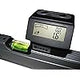 Digital angle gauge with LCD display on a carpenter’s level, woodworking tool