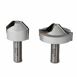 Two carbide-tipped router bits for woodworking, isolated on a white background.