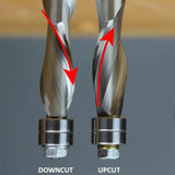 Close-up comparison of downcut and upcut spiral router bits with red arrows showing cutting direction