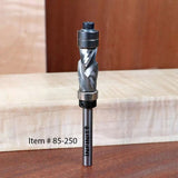 Carbide spiral router bit with bearing, item #85-250, standing on wooden boards.