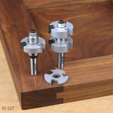 Router bit set for woodworking joinery displayed on a dovetail corner joint