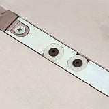 Table saw miter slot with adjustable metal insert, close-up woodworking tool component