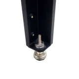 Adjustable metal leveling foot installed on a black woodworking tool leg