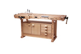 A light natural wood workshop table with a cabinet, drawers, and a workbench top featuring a guide rail and clamp, shown on a solid white background.