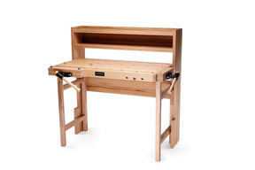A light natural wood workbench with a built-in shelf, adjustable legs, and black metal clamps on the sides, shown on a plain white background.